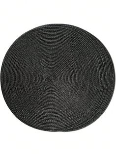 a round black placemat on a white background