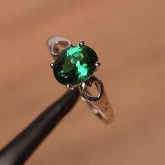 It is lab emerald  ring. The main stone is 7mm*9 mm oval cut.weight about 1.58 carats.The basic metal is sterling silver and plated with rhodium.To change the metal to a solid gold (white/rose) or platinum is also available, please ask for a quotation if you want.You can also go to my shop Home for more elegant rings: https://www.etsy.com/shop/godjewelry?ref=hdr_shop_menu Emerald  is May birthstone More emerald rings:https://www.etsy.com/shop/godjewelry?section_id=20709240Customization is always Oval Green Emerald Ring For May Birthstone, Classic Oval May Birthstone Ring, Oval Green Gemstone Birthstone Ring, Oval Emerald Ring For May Birthstone, Oval Emerald Birthstone Ring In White Gold, Green Oval Birthstone Ring For Anniversary, Silver Emerald Ring With Oval Cabochon, Oval Sterling Silver Emerald Promise Ring, Emerald Oval Cabochon Ring For Anniversary & May Birthstone