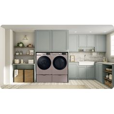 a washer and dryer in a room with gray cabinets on either side of the door