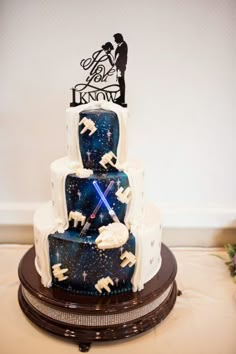 a star wars themed wedding cake on a table