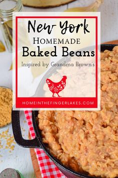 homemade baked beans in a cast iron skillet on a red and white checkered tablecloth