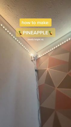 the light is on above the wall in the room that has been decorated with geometric patterns