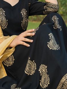 Black ethnic motifs block printed rayon anarkali style flared kurta set with matching pants and tissues embroidered dupatta. Neck: V Neck Sleeve Length: 3/4th Sleeves Kurta Length: Calf Length Work Type: Embroidered Fabric: Kurta & Botton - Rayon Dupatta - Tissue Note: Dry Clean Only. The product will be shipped within 15-20 days of the order placed Measurements: Size Bust Waist Hip XS 34 28 36 Size 36 30 38 M 38 32 40 L 40 34 42 XL 42 36 44 2XL 44 38 46 3XL 46 40 48 4XL 48 42 50 5XL 50 44 52 Straight Kurta Salwar Kameez With Block Print For Diwali, Block Print Salwar Kameez In Mulmul, Eid Block Print Straight Kurta Salwar Kameez, Festive Sharara With Block Print And Straight Kurta, Festive Block Print Sharara With Straight Kurta, Eid Straight Kurta With Block Print, Navratri Straight Kurta Sharara With Block Print, Bollywood Style Sharara With Straight Kurta And Block Print, Festive Straight Kurta Salwar Kameez With Block Print