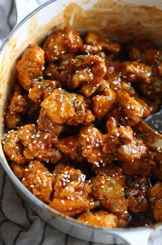 chicken wings with sesame seeds on a blue plate