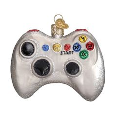 an ornament shaped like a video game controller with the words start on it