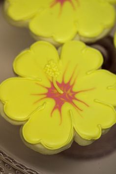 yellow and red flowers on top of cupcakes