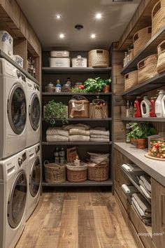 a washer and dryer in a room with lots of shelves filled with laundry items