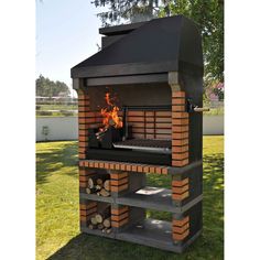 an outdoor bbq grill made out of bricks and wood with flames coming from it