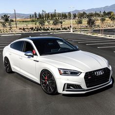 a white car parked in a parking lot