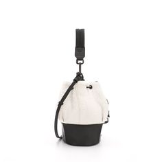 Boucle crossbody bucket bag with structured leather base, comes with padded webbing top strap & adjustable leather crossbody strap. DetailsLightweight nylon & leather bucket bag, with adjustable shoulder to crossbody top strap. Features- Water resistant outer & lining- Drawstring Closure- Adjustable leather shoulder to cross-body strap- Interior zip pocket- key clip lanyardDimensionsW 8 " x H 10 " x D 8" Adjustable Crossbody Strap MaterialsOuter: Polyester BoucleLining: Grey water resistant nylo Key Clip, Leather Bucket Bag, Leather Bucket, Crossbody Strap, Leather Crossbody, Bucket Bag, Pre Order, Cross Body, Zip Pockets