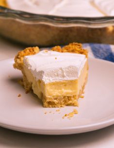 a piece of cake sitting on top of a white plate next to a pie pan