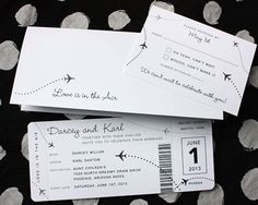 two boarding cards sitting next to each other on top of a polka dot tablecloth