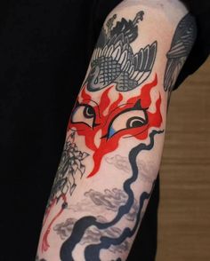 a person with a tattoo on their arm