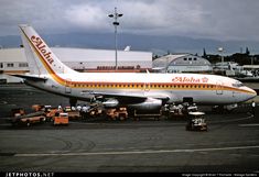 an airplane is parked on the tarmac at an airport