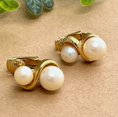 These gold-tone clip-on earrings each have two creamy off-white faux pearls, one slightly larger than the other. SIZE: approx 5/8" CONDITION OF ITEM: Good condition. No noticeable flaws. SEE PHOTOS. Please ask BEFORE purchasing if you have any questions. Check out our shop for LOTS more vintage earrings... we can combine orders to save you shipping! More Vintage Earrings Thanks for supporting a US small business!!! Formal Cream Pearl Earrings, Rustic Crafts, The 1980s, Wood Earrings, How To Antique Wood, 1980s Vintage, Christmas Tshirts, Black Beads, True Vintage