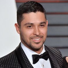 a man wearing a suit and bow tie