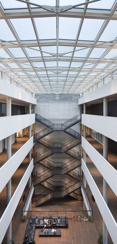 the inside of an office building with lots of windows