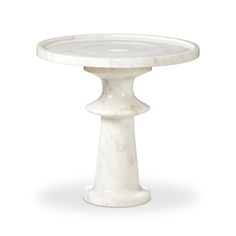 a white marble pedestal table with an oval top and two legs on the base, in front of a white background