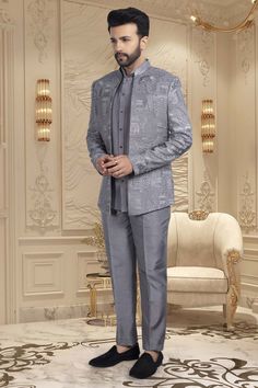 This elegant short sherwani is a luxurious addition to any gentleman's wardrobe. With a beautifully crafted thread embroidery open jacket, this mens sherwani exudes sophistication and exclusivity. Perfect for special occasions and formal events, it is the epitome of refined style. Elevate your look with this M42-S117 sherwani. Elegant Gray Sets With Zari Work, Elegant Gray Kurta With Resham Embroidery, Elegant Gray Designer Wear Sets, Elegant Gray Sets For Eid, Elegant Gray Kurta For Eid, Fitted Gray Sets For Eid, Elegant Gray Festive Traditional Wear, Semi-formal Party Wear Sherwani For Festive Occasions, Semi-formal Festive Party Wear Sherwani