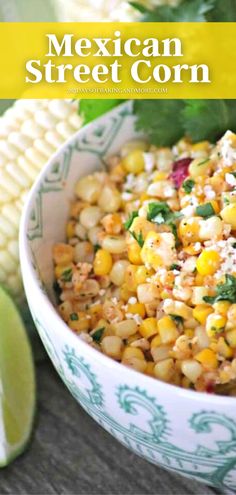 mexican street corn in a bowl with limes and cilantro on the side