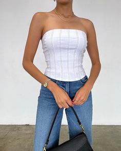 Step up your fashion game with our Irina Tube Corset Top! This stylish piece features a contrast stitch design and a convenient back zipper for easy wear. Perfect for any occasion, this top will elevate your look and get you compliments wherever you go! More Details: - Fits true to size - Does stretch - Back zipper - 74% Rayon 22% Nylon 4% Spandex - Color may vary due to the lighting - Model is wearing a size small Dress Home, Stitch Design, Contrast Stitch, Corset Top, Easy Wear, Fashion Games, Wardrobe Staples, Dresses For Sale, Spandex