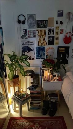 a living room filled with furniture and lots of pictures on the wall next to a bed