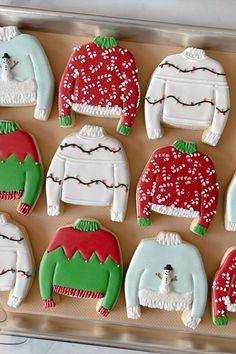 decorated cookies in the shape of ugly sweaters