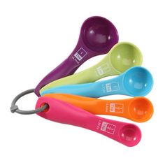 four measuring spoons in different colors and sizes