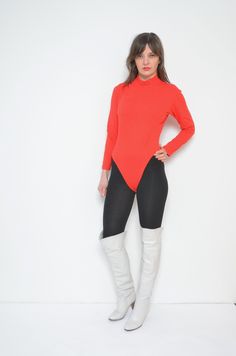 "Vintage 80s mock neck leotard. Long sleeve high neck bright red bodysuit blouse. Sports top. - Label: n/a - Era: 1980s - Color: red - Fabric: polyester - Condition: very good. Ready to wear. - Tag Size: cotton, lycra - Fits: medium MEASUREMENTS (stretchy): *Bust: 37\" (94 cm) *Waist: 30.7\" (78 cm) *From top of the shoulder to crotch: 25.2\" (64 cm) Model is 5.7 feet (174 cm) height." High Neck High Stretch Bodysuit For Fall, High Stretch High Neck Bodysuit For Fall, Fitted High-neck Bodysuit For Fall, Fitted High Neck Bodysuit For Fall, Fall High Neck High Stretch Bodysuit, Fall Stretch Turtleneck Bodysuit, Fall Turtleneck Stretch Bodysuit, Solid Long Sleeve Leotard For Party, Stretch Long Sleeve Leotard For Fall