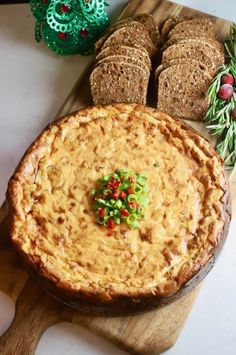 a cheesecake on a cutting board with the words savory havarti and sun - dried tomato cheesecake