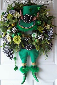 a st patrick's day wreath hanging on the front door