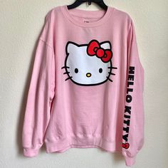 Sanrio Hello Kitty Pink Sweatshirt With Printed Design Brand New Without Tags. Never Worn. Size: Large Lightweight Sweatshirt With Printed Designs. Ribbing At Neckline, Cuffs, And Hem. Soft, Brushed Inside. Cotton 60%, Polyester 40% Machine Wash. Imported. L: Chest (Armpit To Armpit):24” Length (From Top Back Neck Seam To Hem): 27.5” Trendy Hello Kitty Cotton Sweatshirt, Trendy Cotton Sweatshirt With Hello Kitty Print, Cute Character Print Tops For Loungewear, Cute Tops With Character Print For Loungewear, Hello Kitty Print Top For Winter Streetwear, Hello Kitty Cotton Crew Neck Top, Hello Kitty Cotton Sweatshirt In Kawaii Style, Hello Kitty Print Crew Neck Cotton Sweatshirt, Pink Hello Kitty Print Top For Loungewear