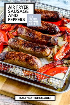 sausages and peppers cooking in a wire basket