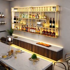 a bar with liquor bottles and glasses on the counter, along with two chairs in front of it