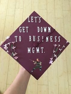 a graduation cap that says let's get down to business mgmt