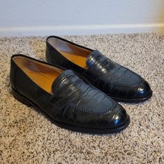 This Is A Great Pair Of Loafers, Made By Mezlan, For Neiman Marcus. Beautiful Black Genuine Alligator Skin. Size Marked Is 10.5 M. These Shoes Will Continue To Look Amazing For Many Years To Come! They Are In Excellent Condition. Thanks For Looking At My Item, And Be Sure To Check Out My Closet For More Great Finds! Thank You! Business Crocodile Pattern Slip-on Oxfords, Office Dress Shoes With Crocodile Pattern And Slip-on Style, Office Slip-on Dress Shoes With Crocodile Pattern, Business Casual Loafers With Crocodile Pattern And Round Toe, Business Crocodile Pattern Almond Toe Loafers, Business Casual Crocodile Pattern Loafers With Round Toe, Crocodile Pattern Loafers For Work, Black Crocodile Pattern Loafers For Work, Classic Office Dress Shoes With Crocodile Pattern