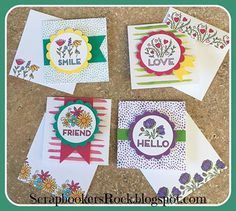 four handmade greeting cards with flowers and words on them, all decorated in different colors