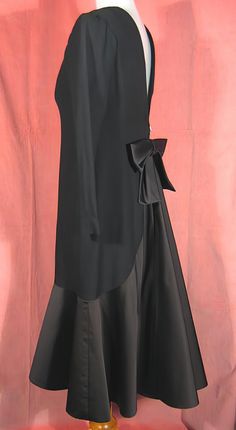 "Dramatic 70's cocktail dress in black crepe and satin by Estevez, who was the youngest designer to win the Coty award. Beautifully made, it's completely lined, and about a size 6. It measures approx. 14\" across slightly padded shoulders, up to 37\" bust, 20 1/2\" outside sleeve length, 28\" waist, 38\" hips, and 43\" overall length. It's in excellent, like new, condition. See my entire shop collection here https://www.etsy.com/shop/RobinClaytonVintage" Black Silk Evening Dress For Formal Occasions, Formal Black Silk Evening Dress, Black Silk Evening Dress For Party, Black Silk A-line Evening Dress, Black Silk Cocktail Evening Dress, Vintage Black Evening Dress For Night Out, 1920s Hat, Flapper Girl, Hat Stands