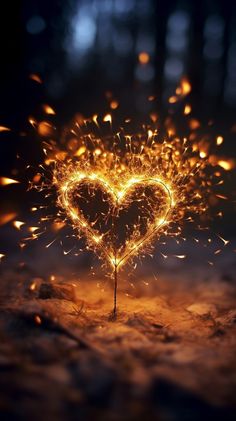 a heart shaped sparkler on the ground