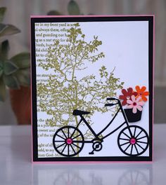 a card with a bicycle and flowers on it