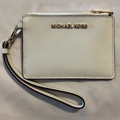 Nwt Michael Kors White Wristlet Condition: Brand New With Tags Color: White Brand: Michael Kors Everyday White Bag With Wrist Strap, White Bag With Wrist Strap As Gift, White Wristlet With Zipper Closure, White Pouch Wristlet With Zipper Closure, White Clutch Wristlet With Zipper Closure, White Zipper Pouch Wallet, White Zipper Pouch, Leopard Clutch, Michael Kors Clutch