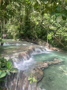 the water is crystal blue and clear in this river that runs through some jungles