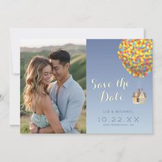 a save the date card with an image of a couple holding each other in front of a hot air balloon