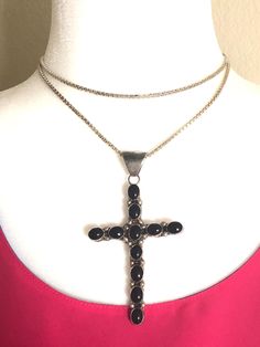 This is a gorgeous, massive, cross pendant featuring 11 black onyx stones set in sterling silver. It has very nice silver beading in between each of the onyx stones. The bail is also substantial, and can accommodate any type of chain/string. The maker's mark JP is stamped on the back side of the cross pendant. The word 'sterling' is also stamped. The sterling silver box link chain is also very substantial, it weighs ~21 grams, it is 30" in length and was made in Italy. Excellent vintage conditio Onyx Cross Jewelry As A Gift, Onyx Cross Jewelry Gift, Spiritual Onyx Cross Jewelry, Black Cross Pendant For Formal Occasions, Black Cross Pendant Necklace For Formal Occasions, Black Sterling Silver Cross Necklace For Gift, Spiritual Black Sterling Silver Cross Necklace, Black Sterling Silver Crucifix Jewelry, Black Sterling Silver Cross Necklace