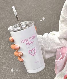 a woman holding a cup with a straw in her hand and the words i love granny much written on it