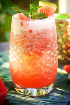 a glass filled with watermelon and ice