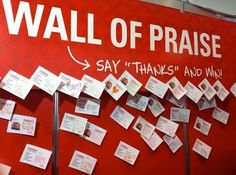 the wall of praise is covered with sticky notes