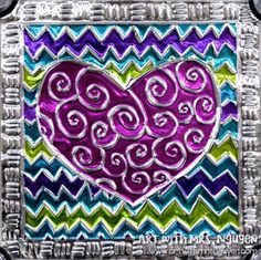 a heart is painted on the side of a metal frame with an ornate design in purple, green and blue