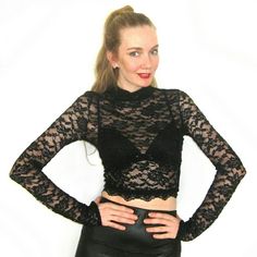 NWT Black Lace Long Sleeve Crop Top Size - Fabric content - 92% nylon, 8% spandex   - Care - hand wash cold, do not bleach, dry flat, do not iron   - Made in USA   - Will ship the same day if bought mon-friday before 2pm PST or next day if bought after 2pm PST Tops Crop Tops Stretch Lace Mesh Top For Party, Winter Party Fitted Crop Top, Black High Stretch Party Top, Black High-stretch Party Tops, Black High Stretch Top For Party, Black High Stretch Tops For Party, Fitted Black Mesh Top For Night Out, High Stretch Black Tops For Party, Stretch Mesh Top For Club In Fall