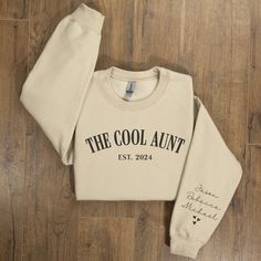 Elevate your aunt's style with our Custom Auntie Sweatshirt, featuring the Cool Aunts Club emblem and a touch of personalization with your children's names elegantly embroidered on the sleeve. This cozy and chic Personalized Aunt Sweatshirt is not just a garment but a heartfelt expression of love, making it the perfect Auntie Gift that she'll cherish and proudly wear as a member of the exclusive Cool Aunts Club! 🤍 ♥ PRODUCT DETAILS & SIZING This pre-shrunk, classic fit sweatshirt is made with a Aunt Sweater, Workout Sweatshirt, Niece And Nephew, Photo Colour, Kid Names, Cute Shirts